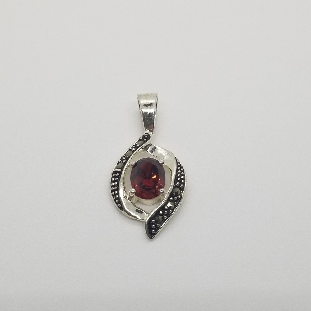 red crystal pendant with charcoal gray crystal border